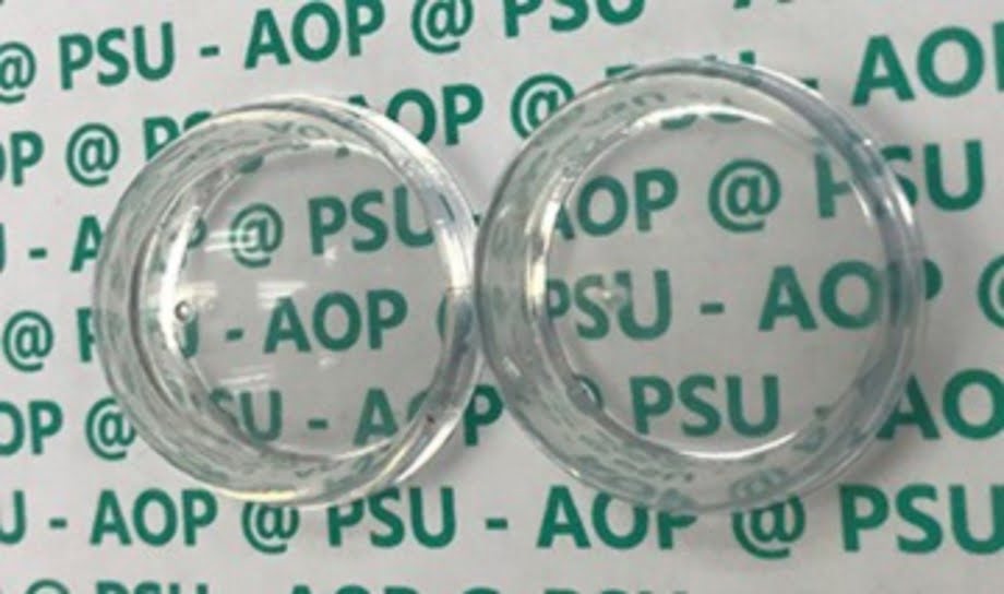 Fluoropolymer Coating For Invisible Plastic Optics